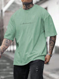 Camiseta gráfica de manga corta casual y holgada con texto para hombre, para el verano