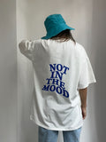 Milky oversize t-shirt and blue panama hat